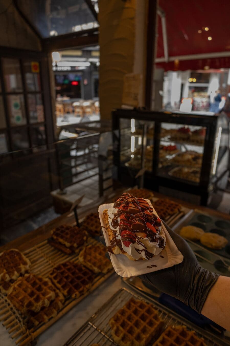 A Liège waffle with fresh strawberries, whipped cream and chocolate sauce at Le Roi de la Gaufre
